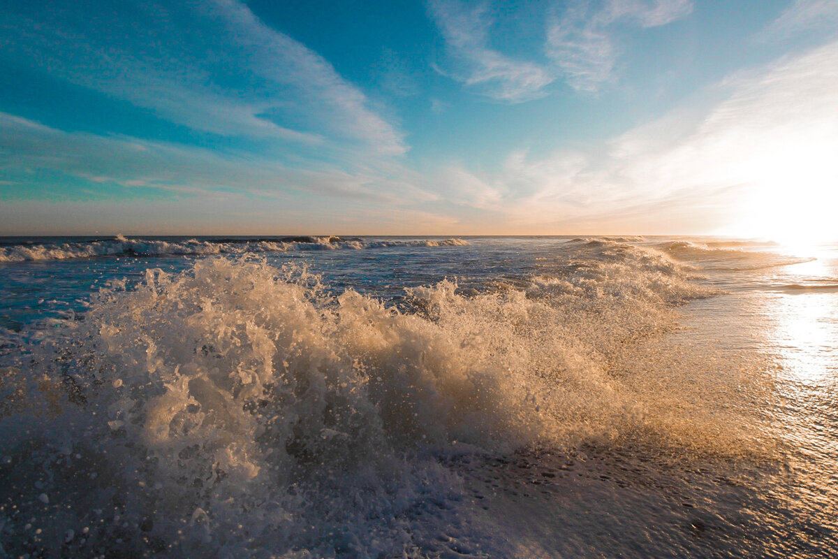 Wave Crashing at Sunrise