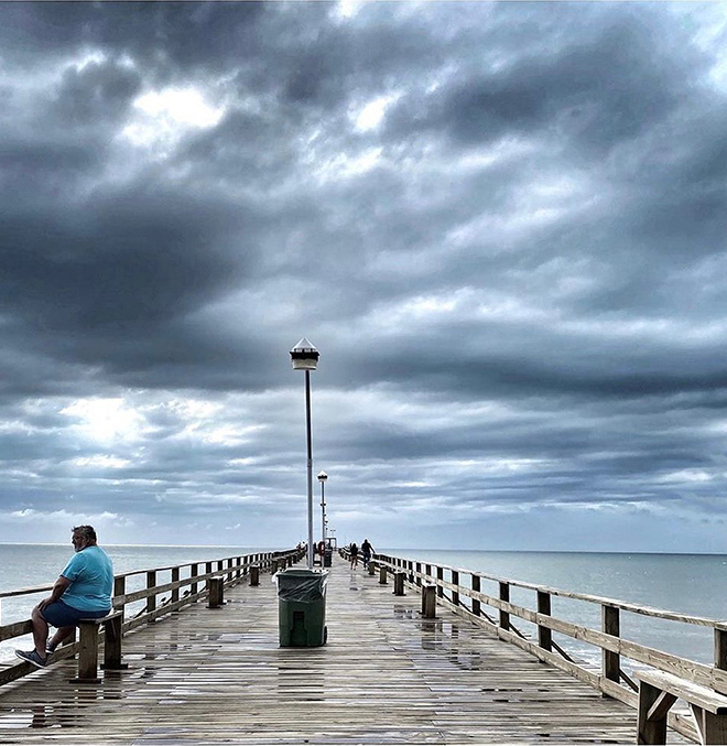 Storm Watcher on the Pier