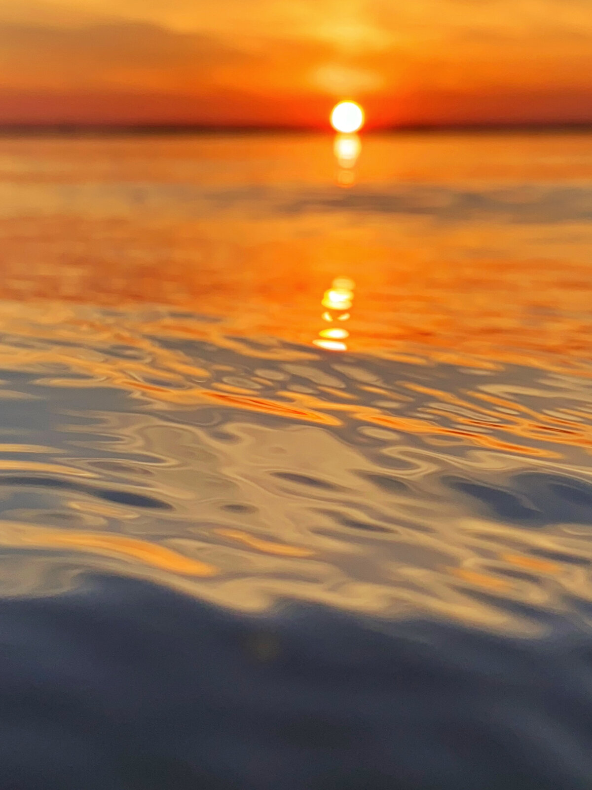 Rippling Sunset Reflection