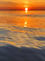 Rippling Sunset Reflection