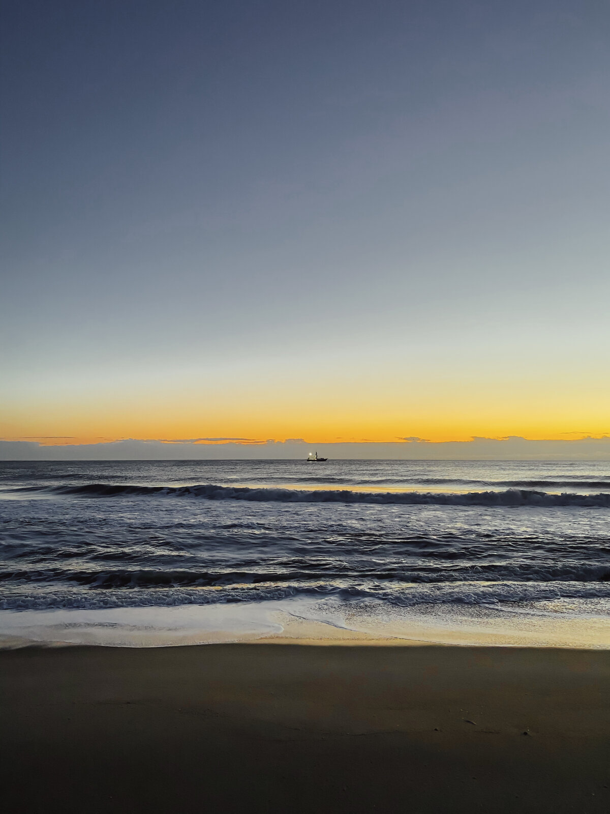 Boat on the Horizon at Dusk