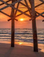 Sunrise Through the Pier Pilings