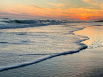 Curling Wave at Sunset