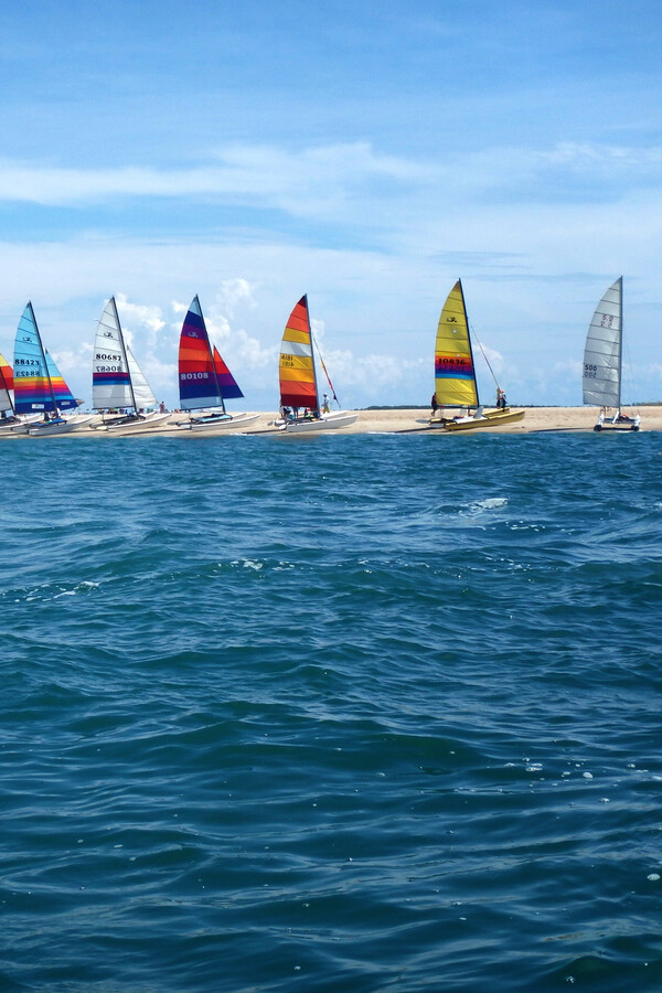 Sailboats Near Lighthouse