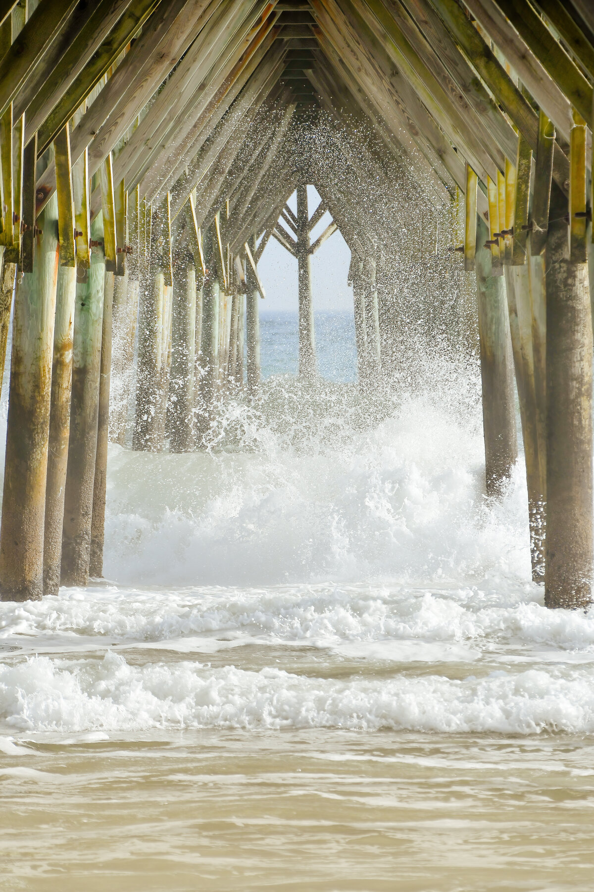 Wave Crashing Beneath the Pier