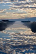 Misty Canal Reflection