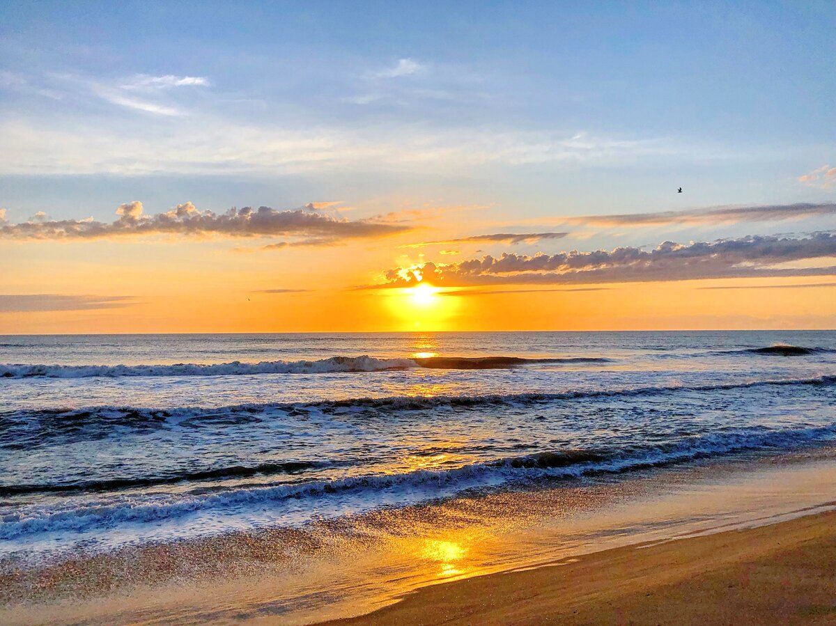 Golden Sunrise Over the Waves