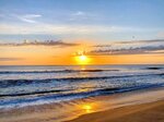 Golden Sunrise Over the Waves